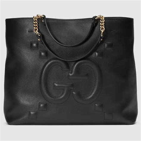 gucci leather tote realreal|Gucci embossed leather tote bag.